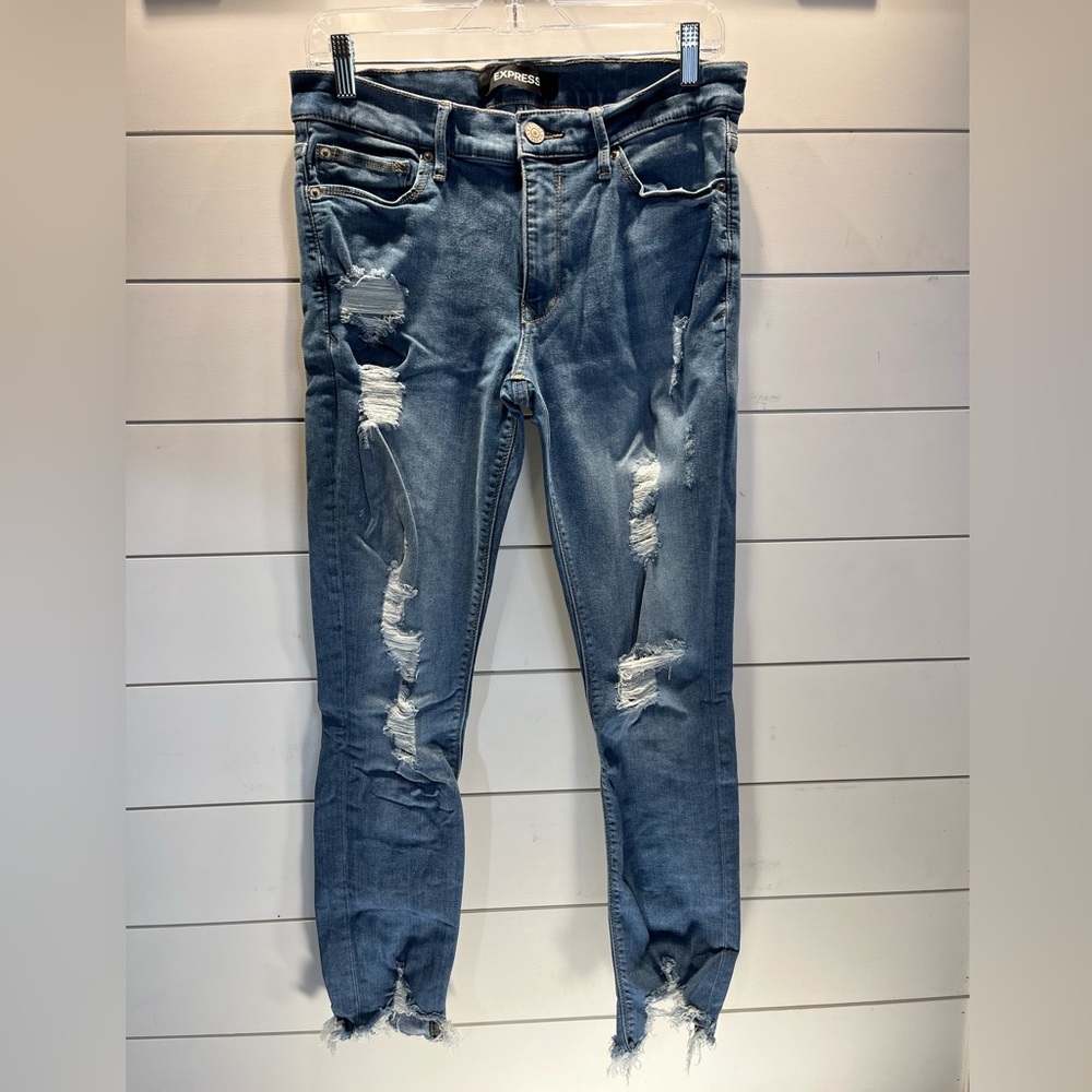 Women’s distressed Express mid rise jeans